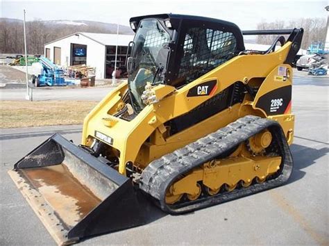 rental for a skid steer with rubber tracks bastrop texas|skid steer bucket rental.